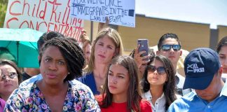 Ayanna Pressley speaking at a podium during an outdoor press event