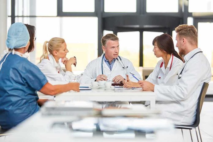 Doctors in a meeting at a hospital conference table