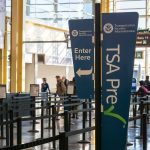 Airport Sting Leaves Passengers Stunned TSA PreCheck sign at airport security
