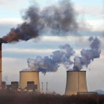 Court-Sized Wrench Halts Grid Overhaul Industrial power plant with smokestack and cooling towers emitting smoke