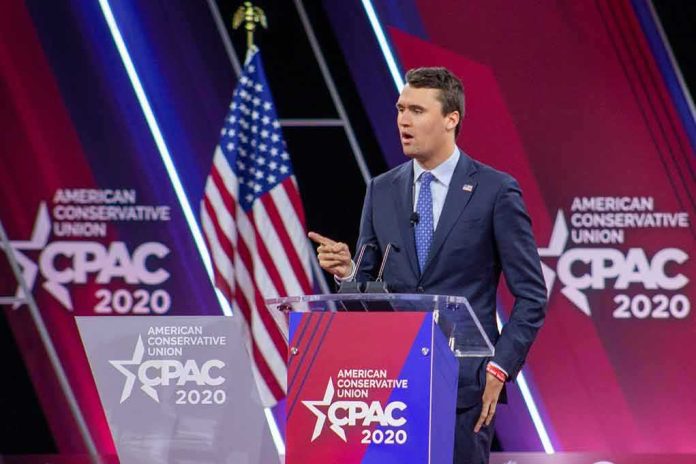 shutterstock_1683086179-1 Speaker in suit at CPAC podium on stage
