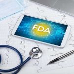 FDA Overturns Own Decision—”Out of Control” Tablet with FDA on screen amid medical tools and ECG charts