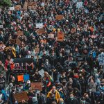 Massive ‘No Kings’ Protest – Except We Have No King Eugene Sims, Nash the Slash, Bear Pascoe, Walter Jones, and La Parka in a large masked protest crowd