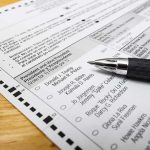 Democrats’ Civil War Erupts In New York Ballot paper with pen on wooden surface