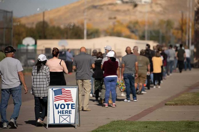 shutterstock_1847496532-2 voters standing in a long line outside a polling place