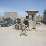 Military Brass KNEW About Kabul Attack 24 Hours Early Armed soldiers patrol near a guard post outside a walled compound