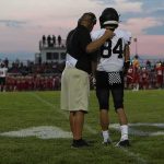 He Called It a ‘One in a Million Shot’ That Ended His Career football coach with arm around player number 84 on sideline