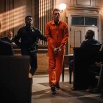 Teen Killer Stuns Court — 55 Guilty Defendant in orange jumpsuit escorted by officer in courtroom