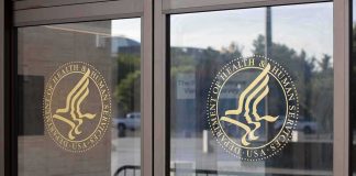 glass entrance doors with government agency seals