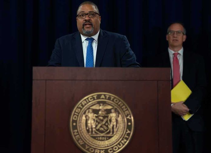 shutterstock_2199567225 Man speaks at podium with New York County District Attorney seal