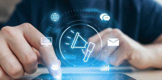 Hands using a smartphone with digital marketing icons overlay