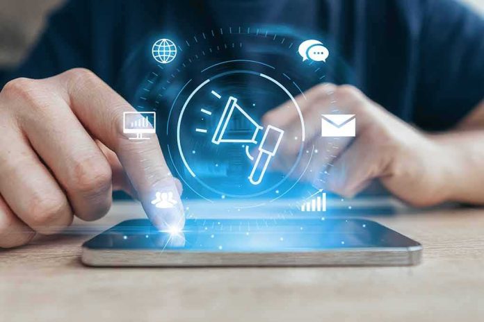 shutterstock_2201677413 Hands using a smartphone with digital marketing icons overlay