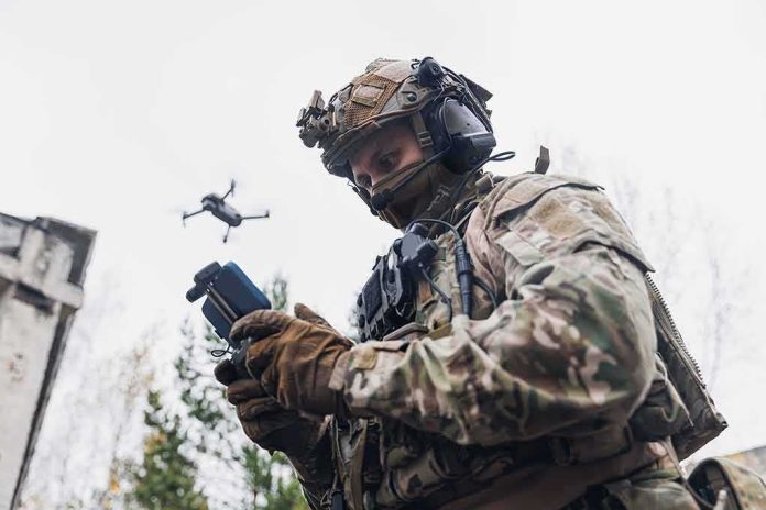 shutterstock_2249726127 soldier operating a drone with a handheld controller