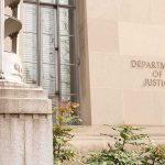 Armed Trip To Kill Conservative Justices Department of Justice building facade with stone sign and window