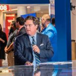 Carlson 2028: The Denial That Launched a Thousand Predictions Tucker Carlson at a news desk in a busy studio setting