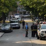 Officer Attacked — See What Triggered It Police officers secure a residential street with patrol cars and yellow tape