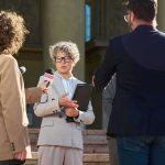 Spokesperson addresses reporters on courthouse steps