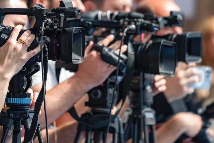 shutterstock_2692761619-3 television cameras on tripods at a media event