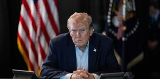 Trump Says Something Was VERY Wrong With Butler Person in suit seated at table with telephones