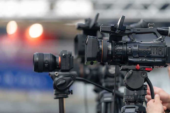 shutterstock_2762343045-1 Professional video cameras on tripods