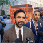 Mayor Boycott Shocks NYC Tradition Zohran Mamdani speaking to reporters on a city sidewalk
