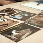 Widow’s Power Move Jolts Murder Case Crime scene photos laid out on a desk