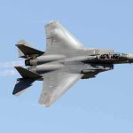 Air Force Tests Its Most Advanced AI Fighter in a 34-Year-Old F-16 fighter jet banking in clear sky