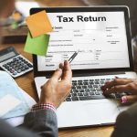 Ukraine Could Use PORN to Fund Its War Laptop displaying tax return form