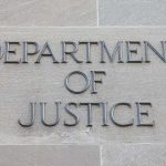 Massive Fraud Crackdown Targets 455 Defendants Nationwide Department of Justice inscription on stone wall