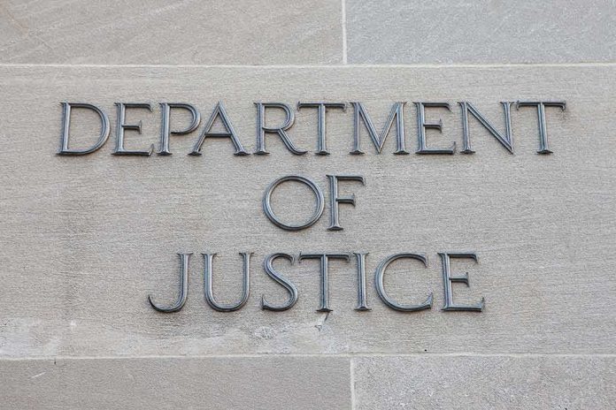shutterstock_506478736 Department of Justice inscription on stone wall