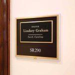 Washington Just Made TWO Massive Moves office wall plaque with black and gold nameplate and room number
