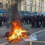 Why France’s RIOTS Could Come Here Next Fire burning on the street amid police presence.