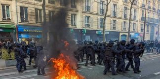 Why France’s RIOTS Could Come Here Next Fire burning on the street amid police presence.