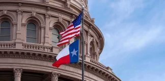 Paxton Demands Answers on Democrat Rival’s DISAPPEARANCE Texas and U.S. flags in front of a capitol building dome