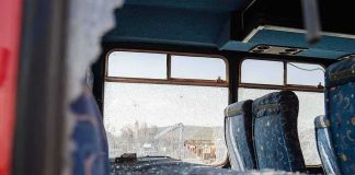 9/11 Hero’s Father Issues GRIM Warning Bus interior with shattered windows and blue patterned seats