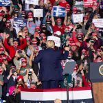 Trump Tells Voters What Decides the MIDTERMS Crowd at a political rally with speaker on stage; Dontrelle Inman present in the audience