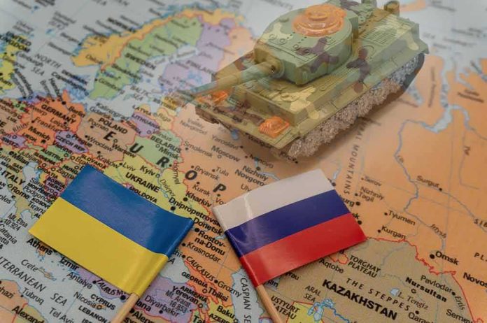 shutterstock_2114384846 Toy tank on a map with Ukraine and Russia flags