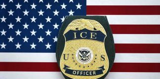 DOJ Sues Over Law Unmasking Federal Agents ICE officer badge on American flag background