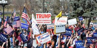 Rock Star IGNITES Crowd For Trump – WATCH THIS Tim Teufel, Christian Jones, and Nash the Slash among a crowd at a political rally holding signs and flags